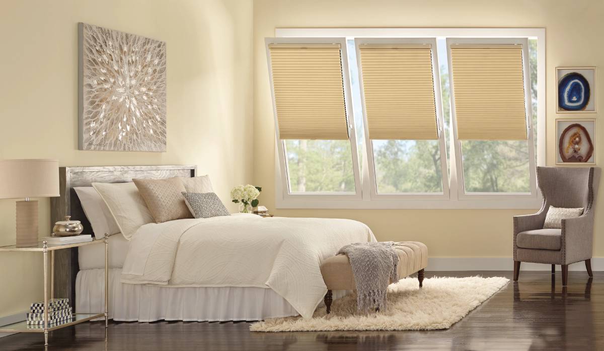 Our Blog 8 Duette® Cellular Shades covering three tilt and turn windows in a bedroom near Chicagoland, IL