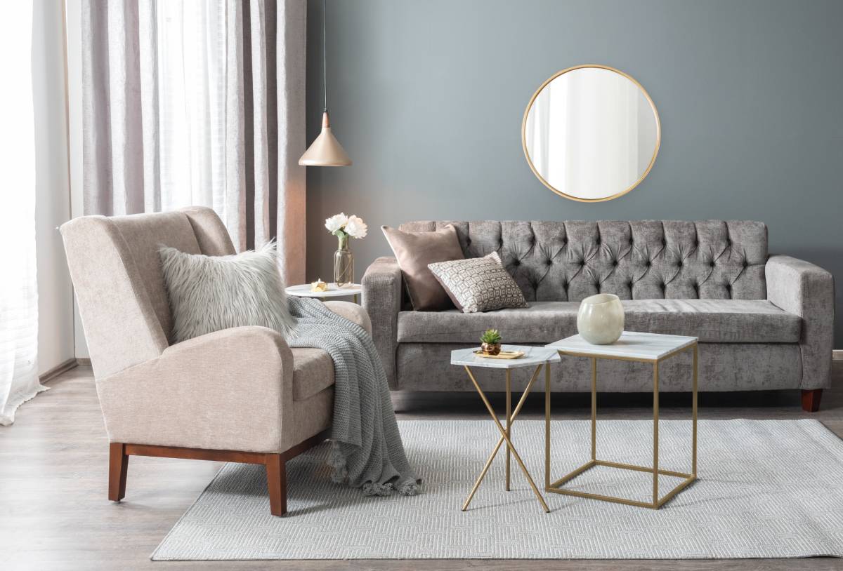 Our Blog 5 Custom drapery in a modern living room with a tufted sofa and armchair at Beyond Shades near Chicagoland